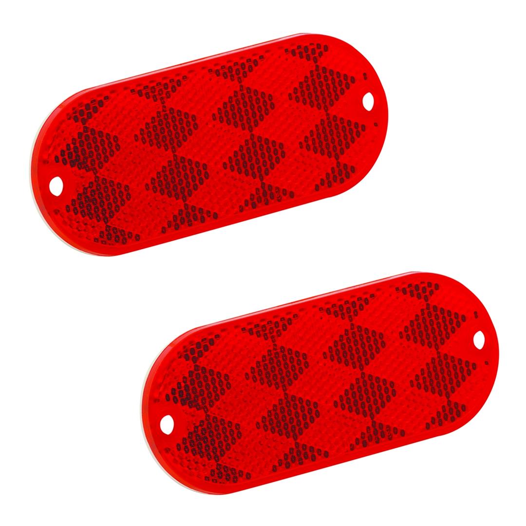 Two red rectangular vehicle reflectors with a checkered pattern and mounting holes.