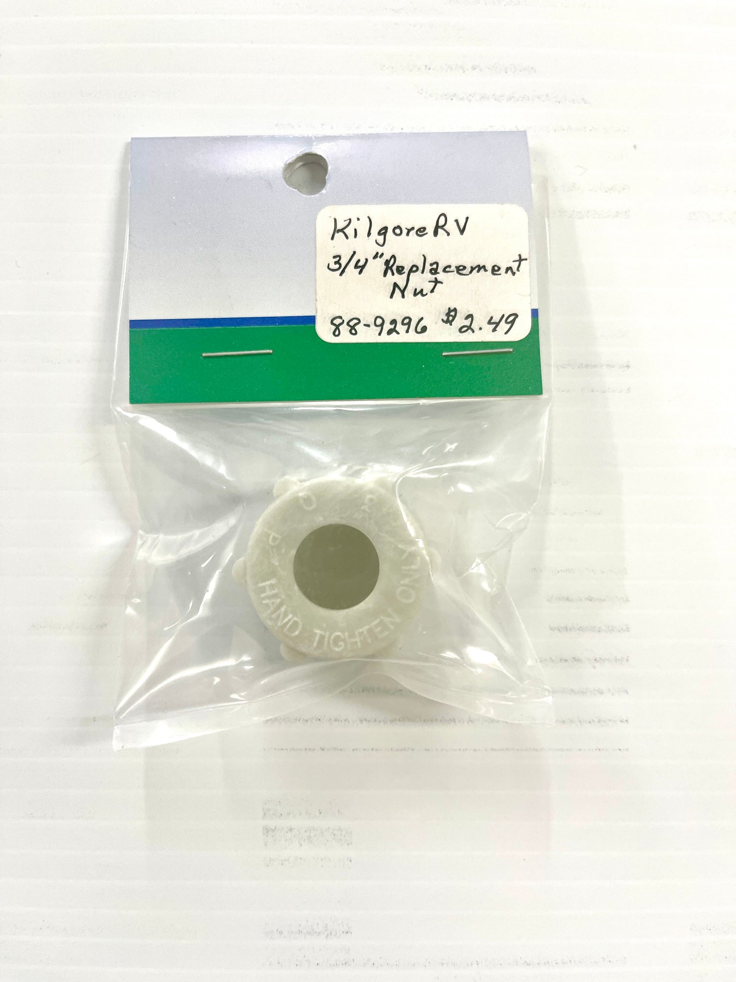 A 3/4 inch white plastic nut for PEX tube, packaged in a clear plastic bag with a label showing the product details.