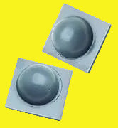 Two round, gray rubber bumpers designed for use with awnings, set against a yellow background