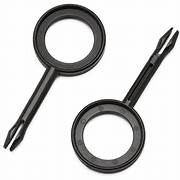 Two black metal awning handle pins and a circular ring for mounting awnings.