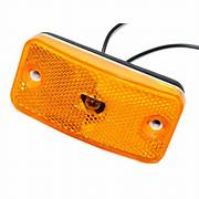 Rectangular amber clearance light with a lens and wiring for mounting in a vehicle.