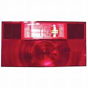 Red tail light lens with a clear back-up light, for a vehicle.