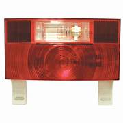 A red stop, turn and tail light with a white license plate bracket.
