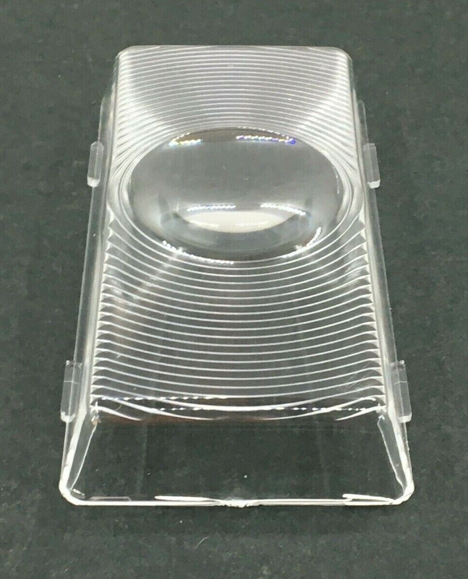 A clear plastic lens for a porch light, with a curved shape and a central fastener.