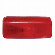 A red tail light lens for a vehicle, viewed from the front with a clear and unobstructed angle.