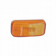 Rectangular amber tail light lens for a vehicle.