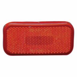 Red rectangular tail light lens for a vehicle.
