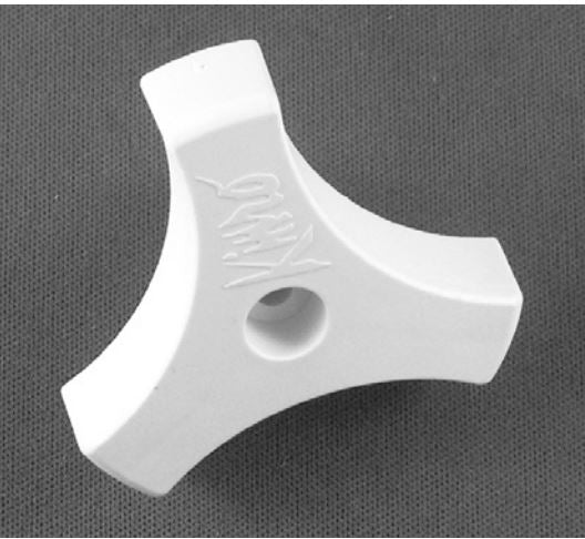 A white triangle shaped window crank knob.