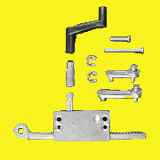 A Strybuc window rack operator with metal and plastic components, including mounting holes, links, crank handle, and handle extension.