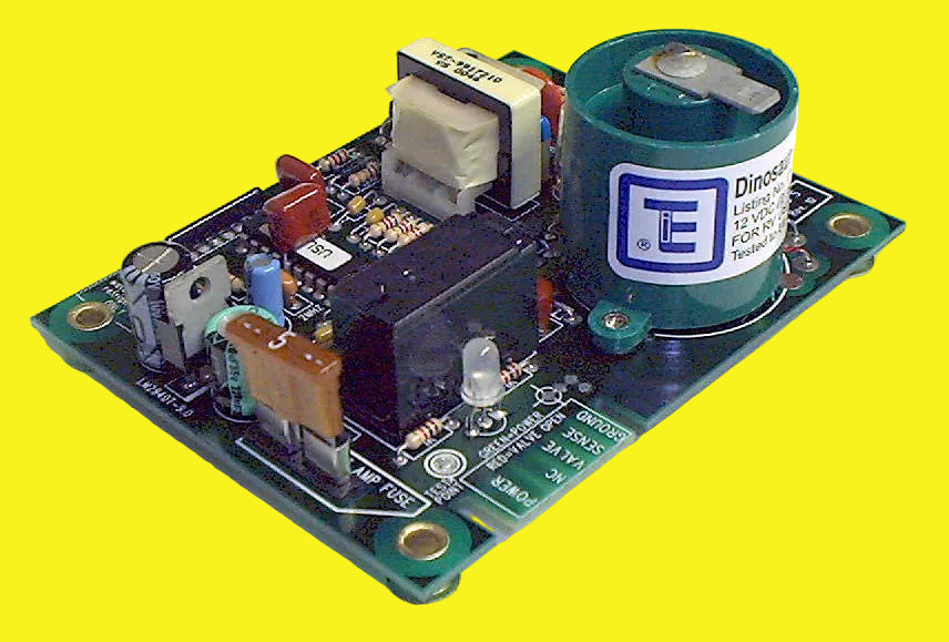 A Dinosaur Electric Ignition Control Circuit Board, with various components such as capacitors, connectors, and a branded label on the front.