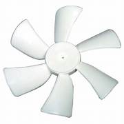 A single white fan blade with a central hub for a roof ventilation system.