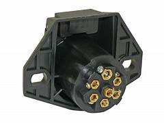 A black Pollak trailer wiring connector with a 7-way round socket design, made of glass filled nylon with solid pins.