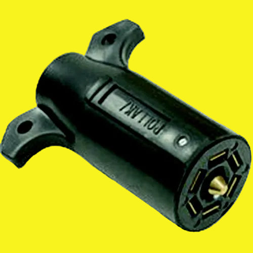 Black automotive connector with gold contact points on a yellow background