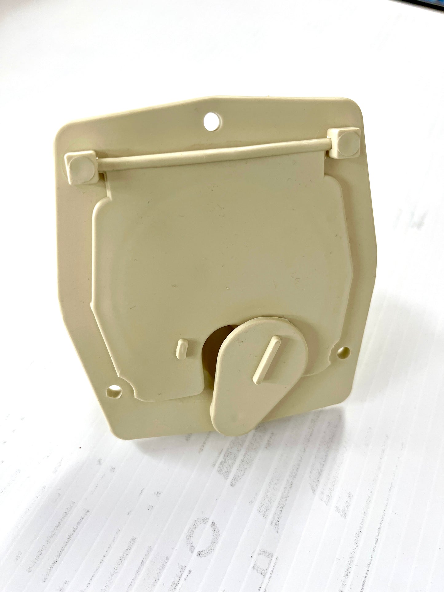 A beige or colonial white cable hatch with a cut-out for cable management.