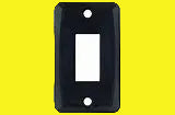 A single black switch plate cover with a simple design, featuring an opening for a switch.