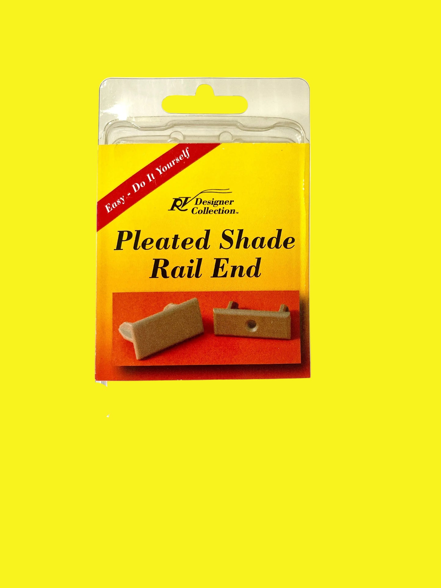 Packaging for RV Designer Pleated Shade Rail End, showing the product through a clear plastic window, with a yellow and red label featuring the product name and a picture of the shade.