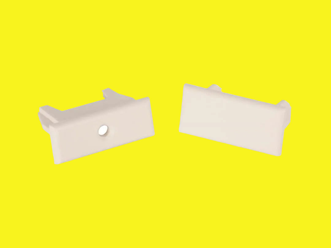 A pair of white pleated shade rail end caps designed for RV windows.