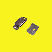 A brown magnetic catch with a flat metal plate.
