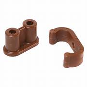 Two brown barrel catches with nylon clips for cabinet doors, set against a white background.