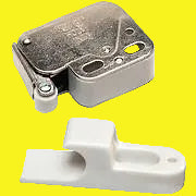 A silver-colored metal cabinet latch with a plastic catch.