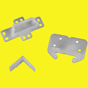 A set of white drawer slides with rear sockets and two corner slides, along with mounting hardware, isolated on a yellow background.