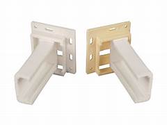 Two white plastic drawer slide sockets