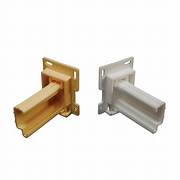 Two drawer slide sockets, one in yellow and one in white, with adjustable bases.