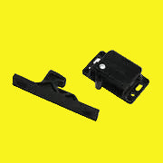 Black plastic push latch for cabinets and drawers.