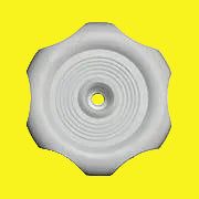 A white plastic window crank knob with a circular design and a central bolt for installation.