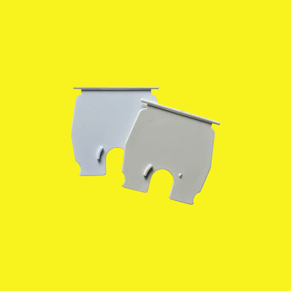 Two pieces of electric cord hatch lids in polar white and colonial white colors, designed to cover and secure electrical cords.
