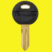 A blank key with a black handle and gold-colored metal shaft, featuring the TriMark logo.