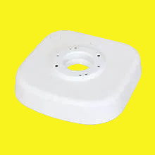 White toilet riser designed for specific toilet models, featuring a round shape with a central mounting hole and multiple exterior screw holes.