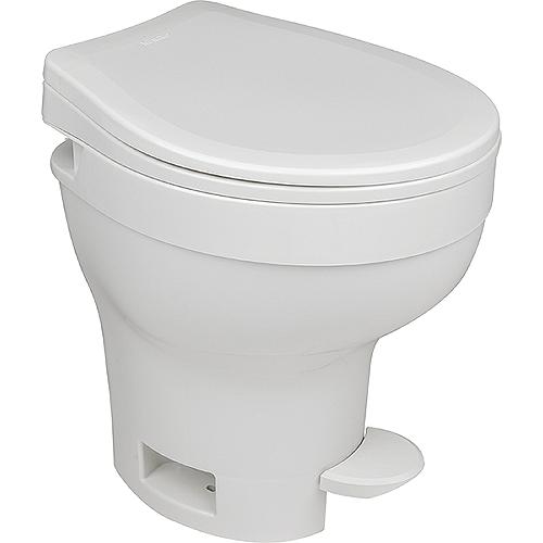 A white, high-profile Thetford Aqua-Magic VI toilet with a closed lid and a visible flushing pedal.
