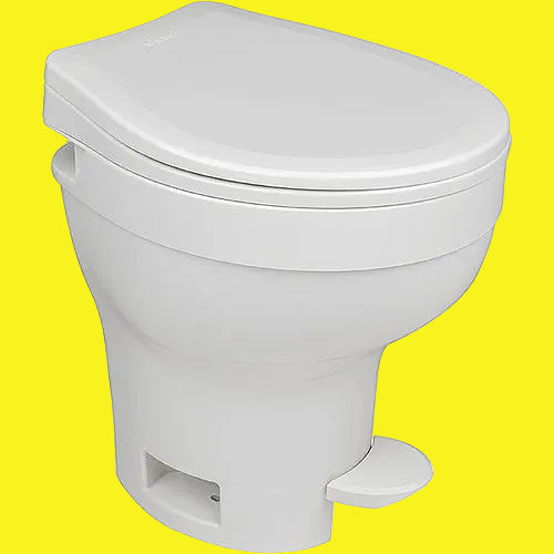 A white, high-profile Thetford Aqua-Magic VI toilet with a closed lid and a visible flushing pedal.