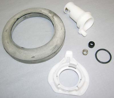 A set of toilet parts including a water valve, seals, and a spring retainer.
