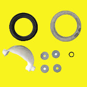 A set of toilet waste ball kit components including a waste ball assembly, a closet flange seal, a waste ball seal, and a waste ball drive arm.