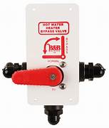 A Thetford Hot Water Tank Diverter Valve with a red plastic handle and black components, mounted on a white square-shaped enclosure with the text 'HOT WATER BYPASS VALVE' printed on it.