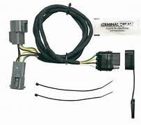 A vehicle to trailer wiring harness kit, including a vehicle side 4 flat connector, corrosion-resistant terminals, a dust cover and grease packet.