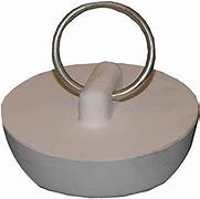 A beige rubber stopper with a metal ring for sinks.