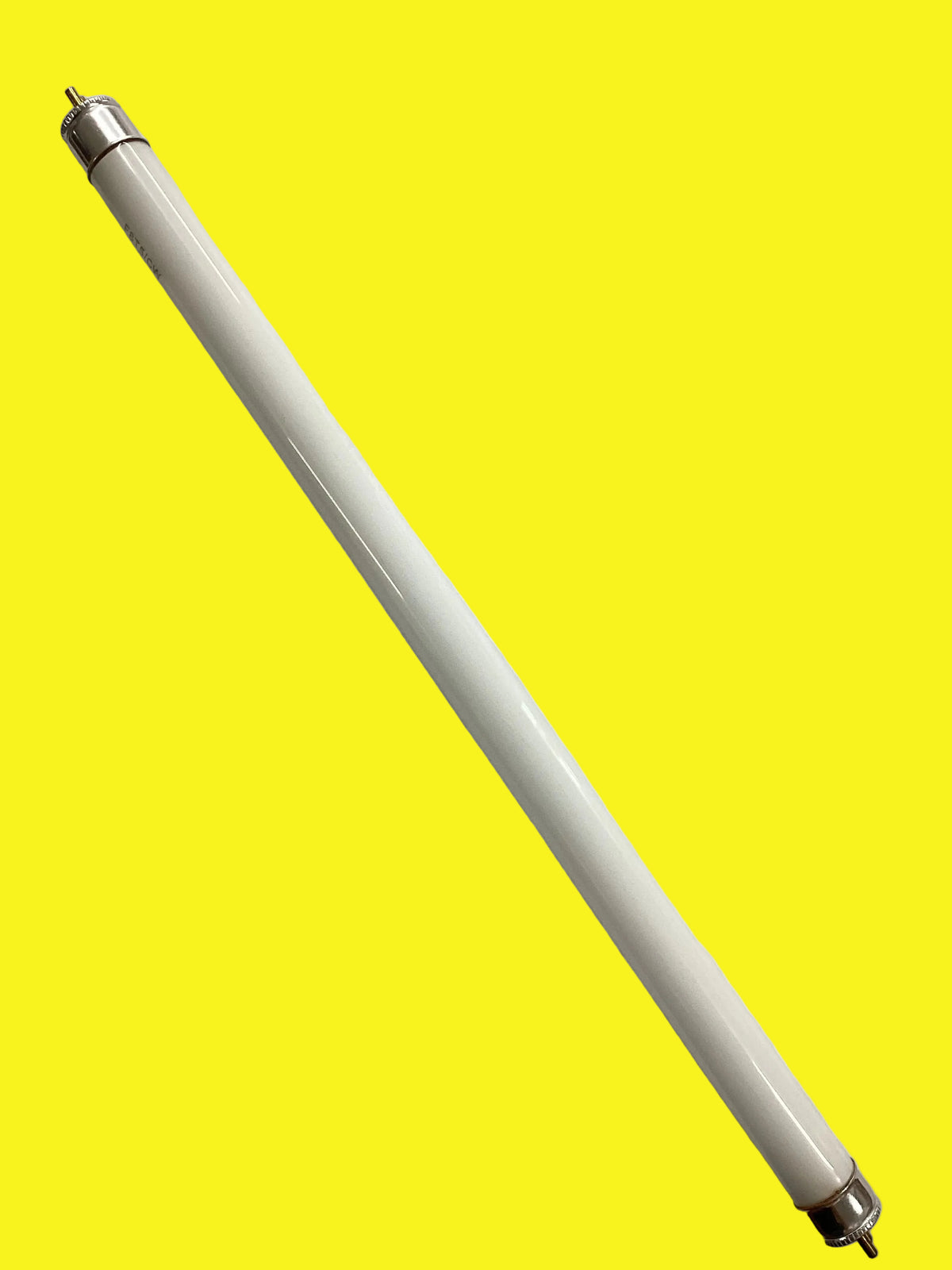 Fluorescent light bulb on a yellow background