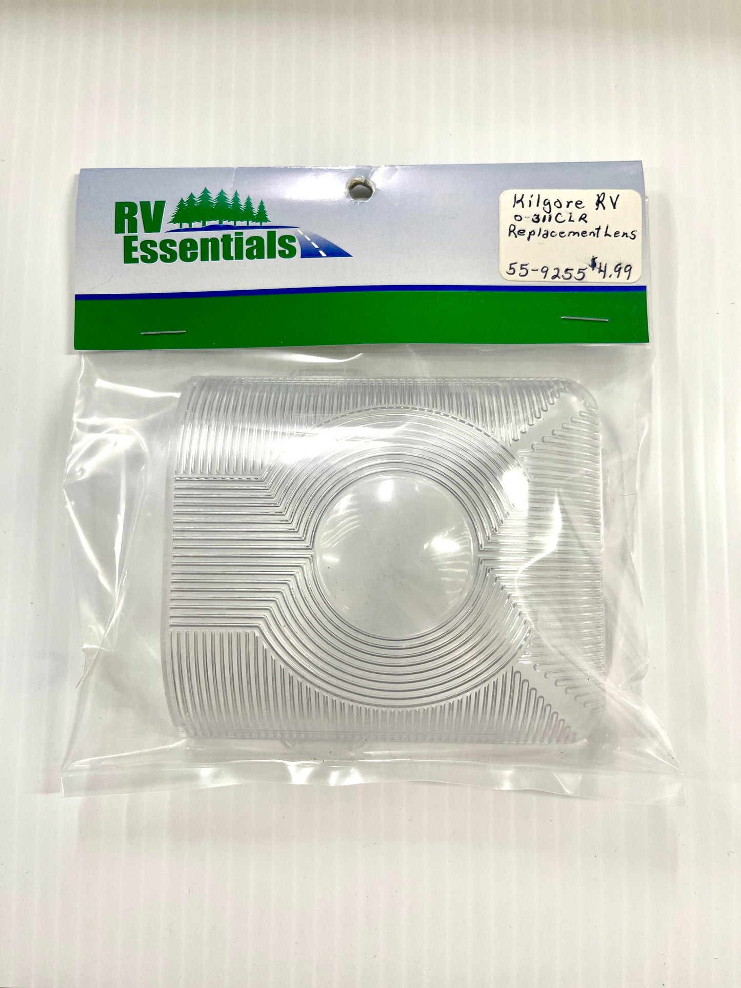 A clear plastic lens for vehicle interior lighting, packaged in a clear plastic bag.