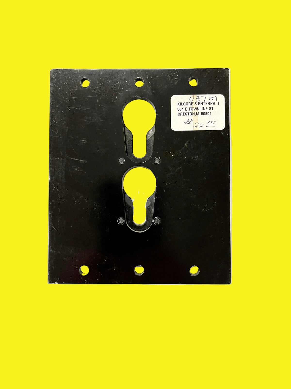 A black metal TV mount bracket with two mounting holes.