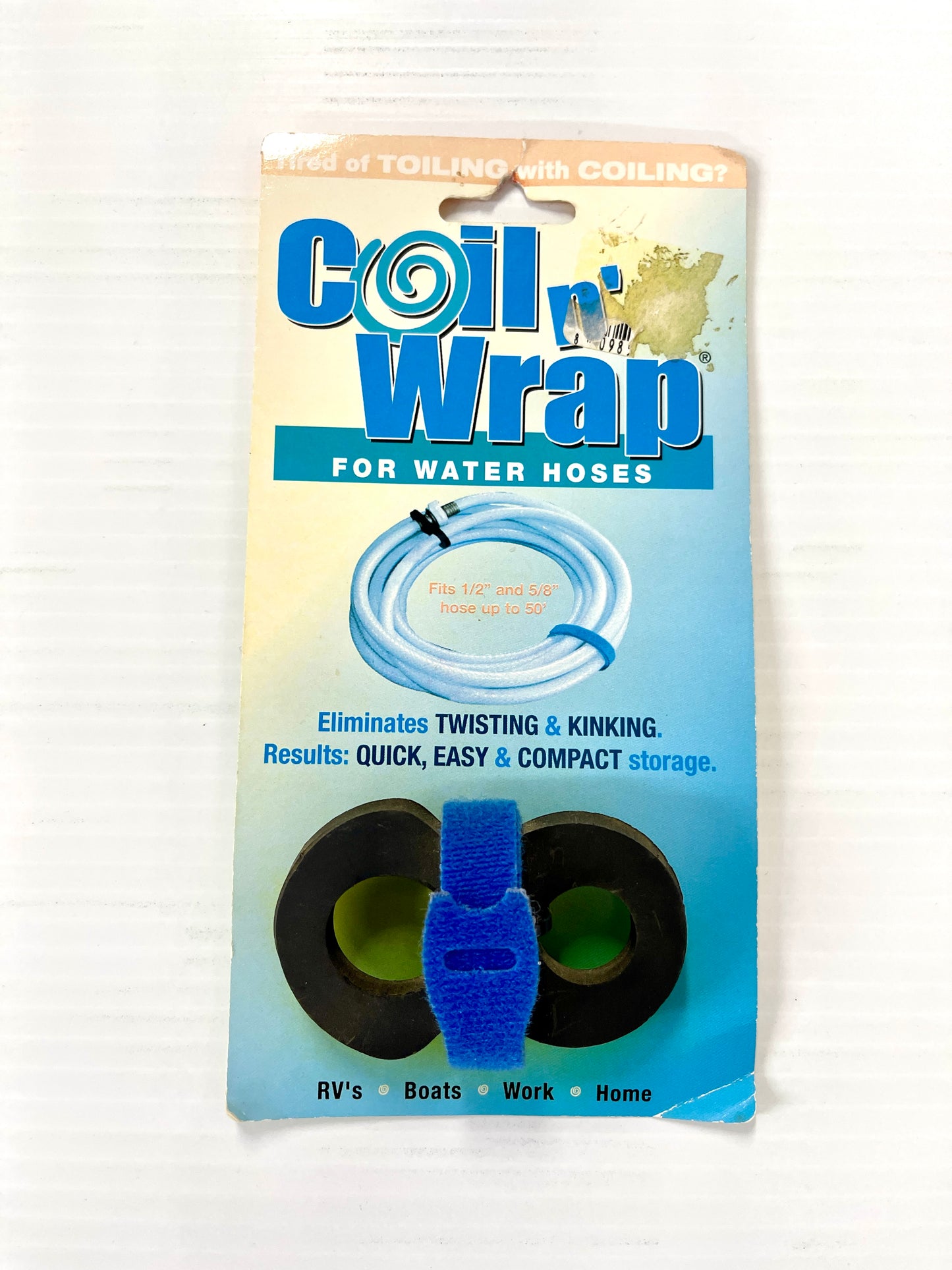 Packaging for 'Coil Wrap' for water hoses, showing the product in use with an RV and a boat, and describing its features such as eliminating twisting and kinking, being compact, easy and compact storage, and suitable for RVs, Boats, Work, Or Home.