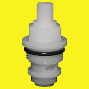 A white faucet cartridge with a clear center and black seals around the base.