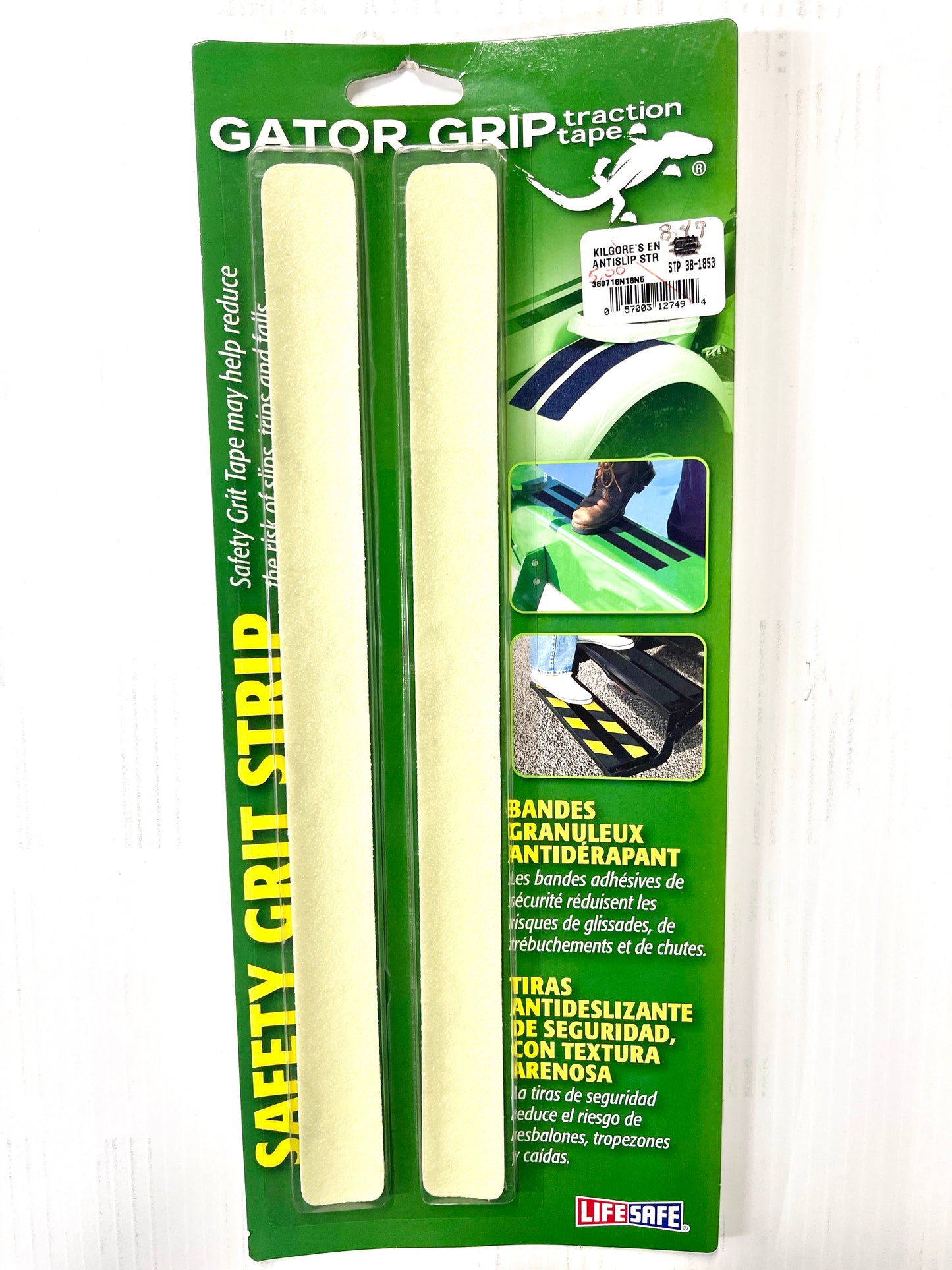 Packaging for Gator Grip Safety Grit Strip with product visible through a clear plastic window, featuring green and yellow colors with text and illustrations describing the product's use and features.