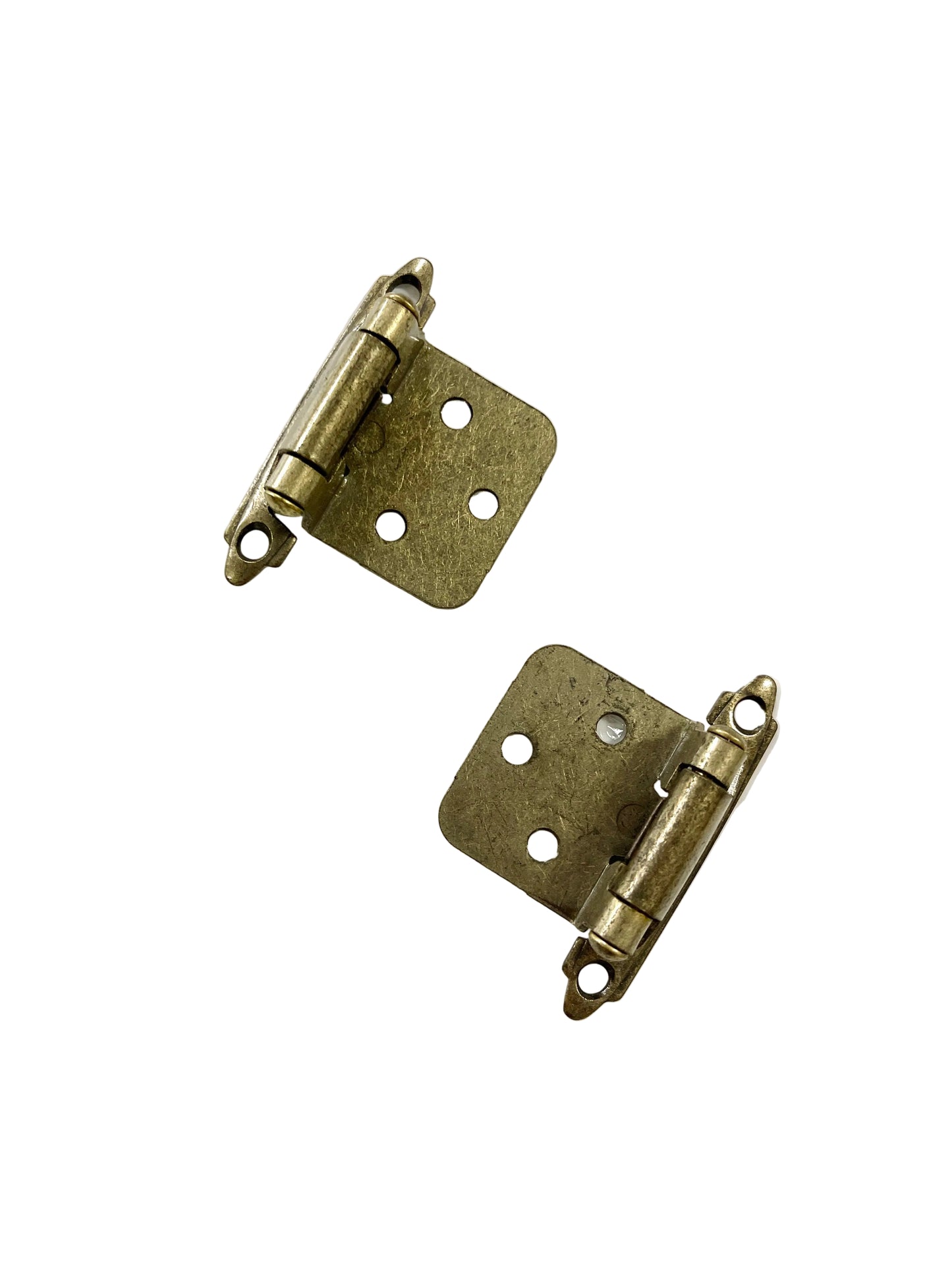 A pair of brass cabinet hinges with visible screw holes, set against a white background.