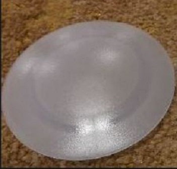 A frosted plastic lens for a ceiling light, with a diameter of 4-1/4 inches, displayed on a textured surface.