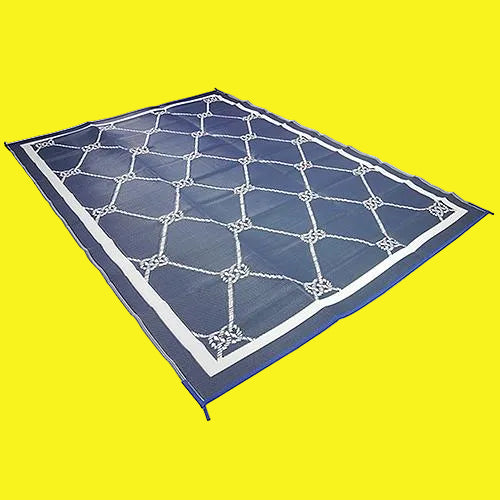 A rectangular outdoor patio mat with a geometric pattern, featuring a combination of blue and white colors.