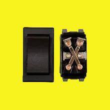 A black momentary slide-out switch with four terminals visible on the side.