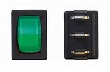 A black and green multi-purpose switch with a rocker-style mechanism and a light-illuminated cut-out.
